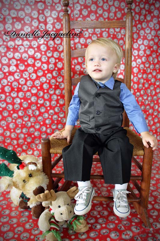 final edit of diy holiday photos for blog by danielle jacqueline in desoto county ms with little boy and his christmas stuffed animals with wrapping paper on the wall and floor