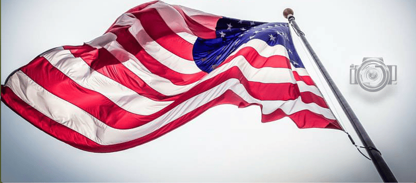 image of american flag from the bottom of flagpole in olive branch mississippi where photographer is honoring our Lord God by discussing the national day of prayer for faithful believers in the midsouth