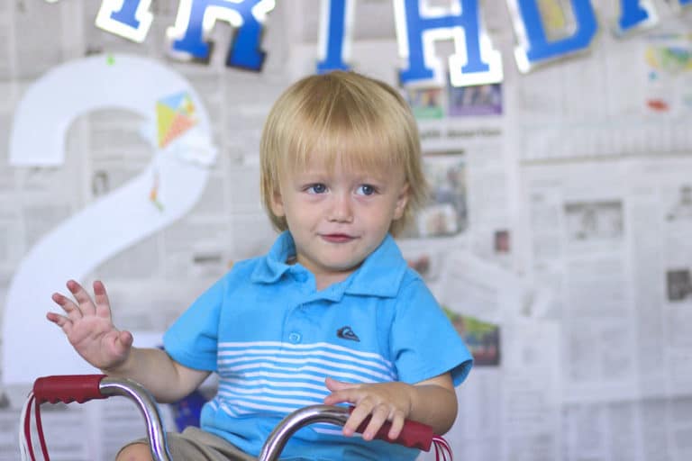 terrible two boy on tricycle at home for diy photo session with mommy at danielle jacqueline photography studio