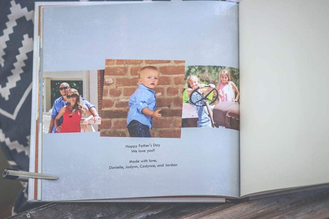 family salutation in father's day photo album book idea by photographer in southeast memphis tn danielle jacqueline showing love for husband in spring