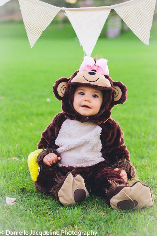 celebrating birthdays during october with babies in fall themed outfits and flag props in grass super cute ideas by danielle jacqueline photography