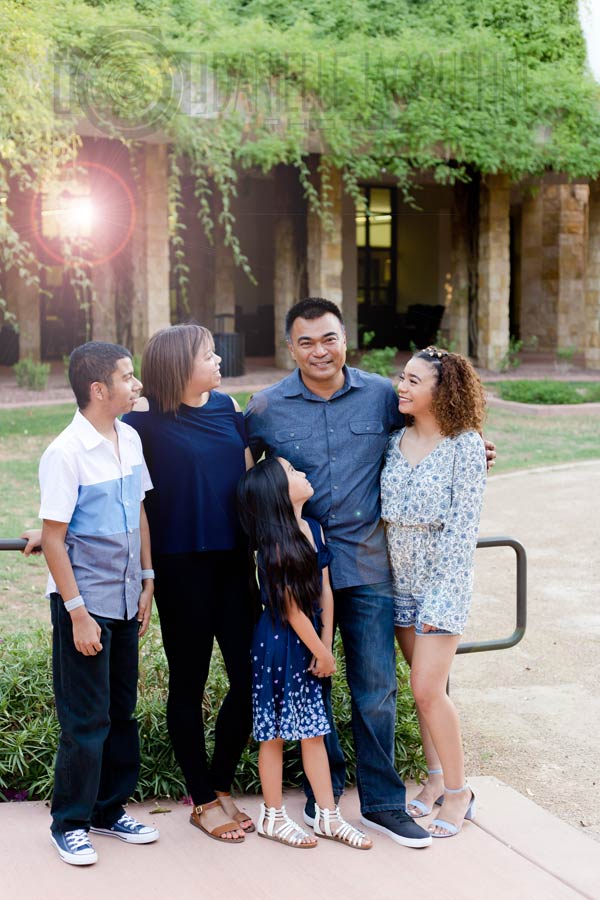 beautiful family portrait with lush natural greenery and lens flair on father's day for veterans in america