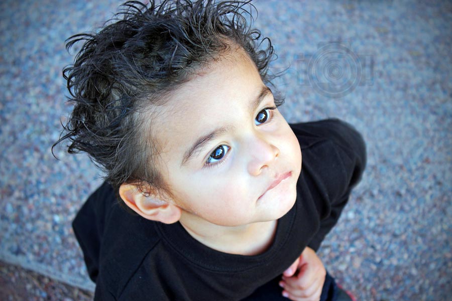 looking up spoked hair black shirt toddler portrait for large mexican family photoshoot by photographer danieller jacqueline in olive branch ms and southeast memphis