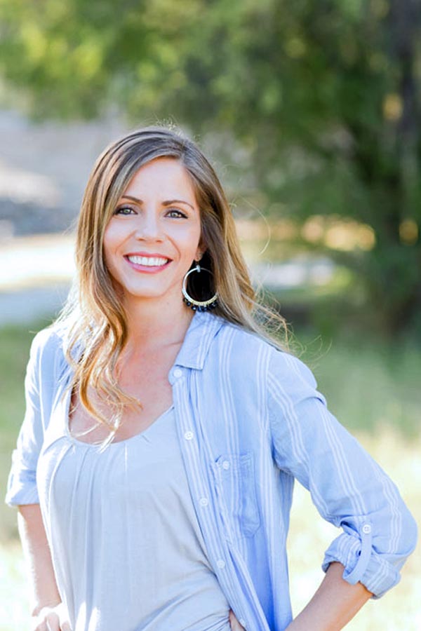 danielle trask hands on hips smiling hoop earrings button up in front of trees outdoor headshot and fresh 48 photographer olive branch ms