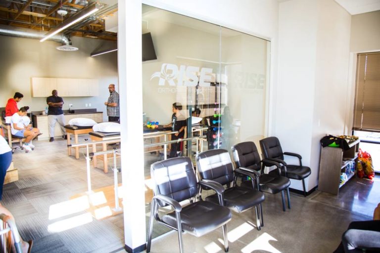 entrance of new physical therapy practice with waiting room and individual evaluation rooms open floorplan photo by business photographer danielle jacqueline