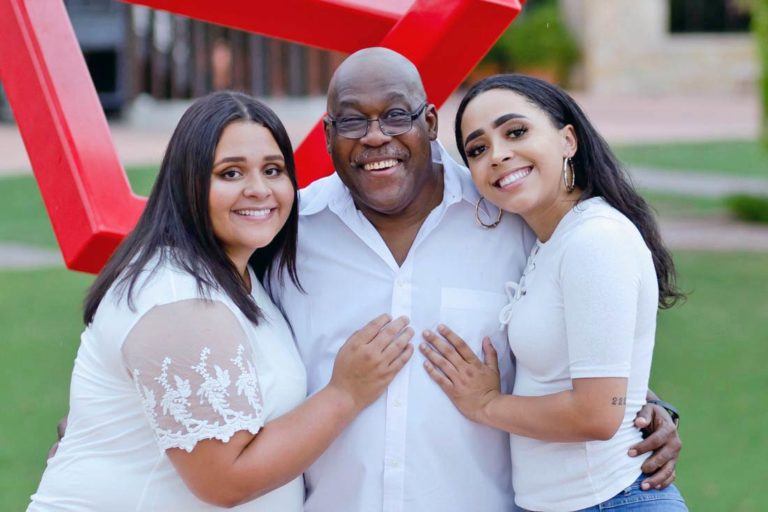 grandpas kin standing by love sign with sibling ladies placing hand on chest proud moment green grass in back memphis family portrait session by danielle jacqueline southern comfort