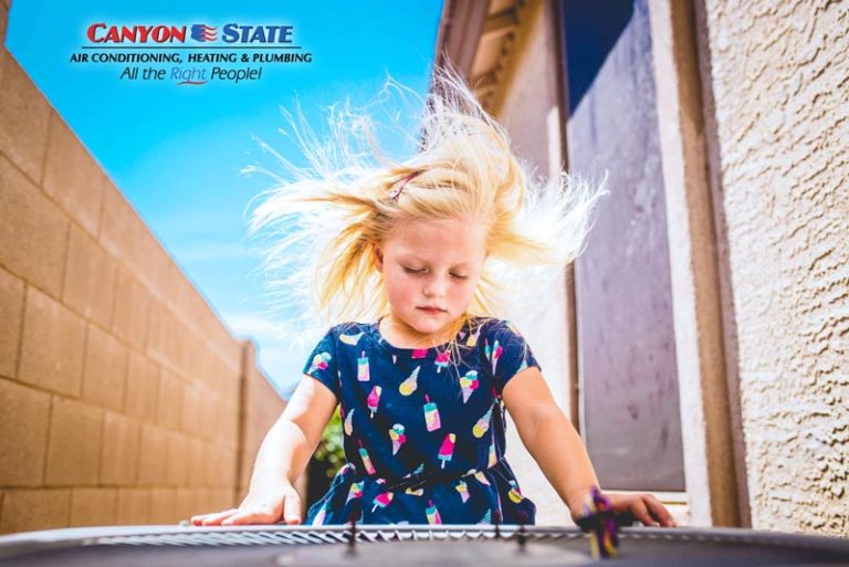 air conditioning unit outside on side of house with little girl hair blowing in fan hot mississippi day needing local hvac company advertisement photographer danielle jacqueline in desoto county also serving memphis