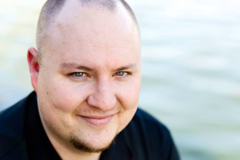 close up headshots of medical industry professional water background black shirt good smile looking up at camera for business with danielle jacqueline now located in olive branch ms