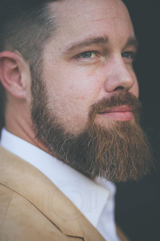 close up headshot vertical tan suit beard general contractor headshots memphis tn by danielle jacqueline photography