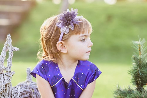 young cancer survivor posing for children's photography session where mother gave danielle a review for quality portrait services in memphis tn