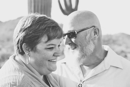 husband and wife natural smiles during family photoshoot in desert by olive branch photographer in mississippi for past reviews by clients across country 2018