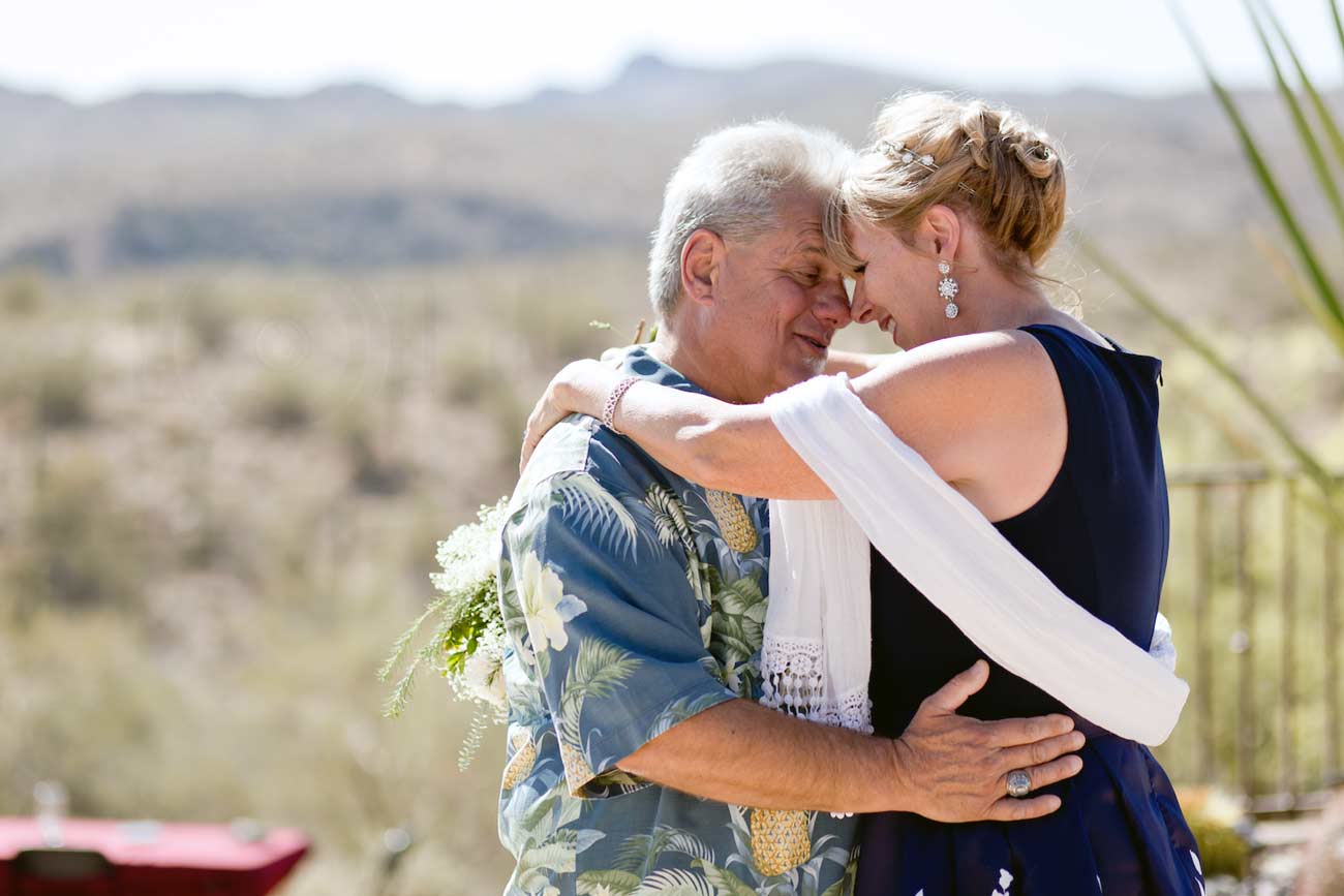 groom and bride foreheads together proposing love for one another during beautiful outside marriage ceremony in arizona first dance captured by danielle jacqueline out of olive branch ms