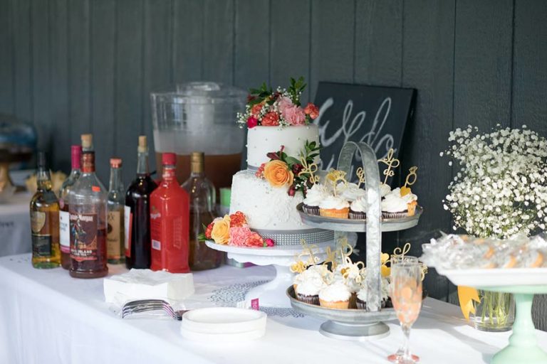 images of wedding cake and refreshments prepared for reception outdoors captured by danielle jacqueline photography down in florida panhandle