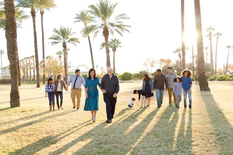 large family group picture by danielle jacqueline using tree shadows and golden hour at park during easter sunday celeebration