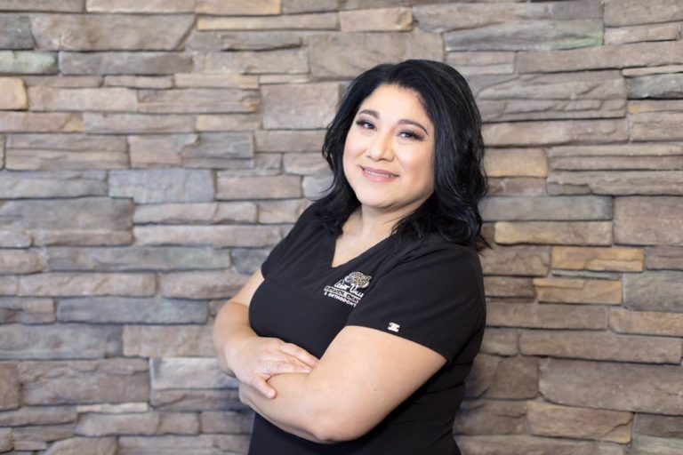 stone wall background in black scrubs pediatrician photo shoot for dentistry by memphis tn photographer danielle jacqueline