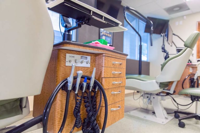 cleaning sprayer and grinding teeth treatment tools from behind patient chair at pediatric dentistry capture by dental photographer danielle jacqueline for local company website