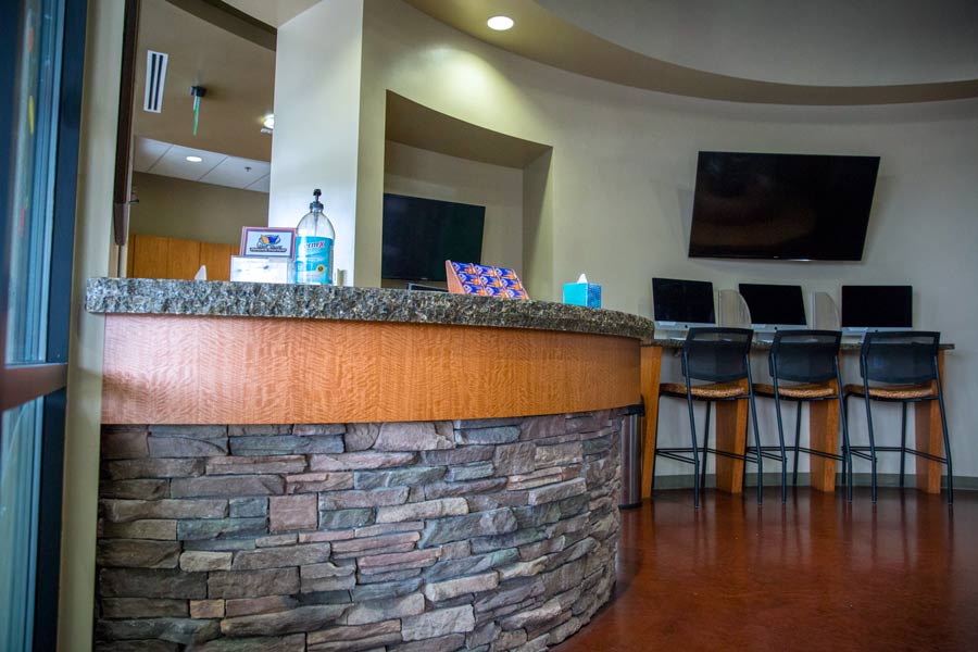 entrance of dental practice photographer danielle jacqueline near memphis tn showing patient computers Tv and open space for kids