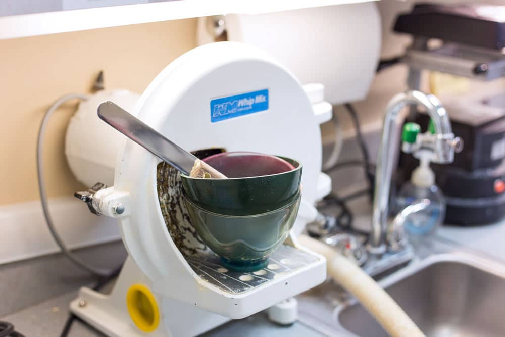 mixing bowls for tooth moldings at dentist clinic for website content and social media posts captured by danielle jacqueline services in desoto county mississippi next to sink and other medical equipment