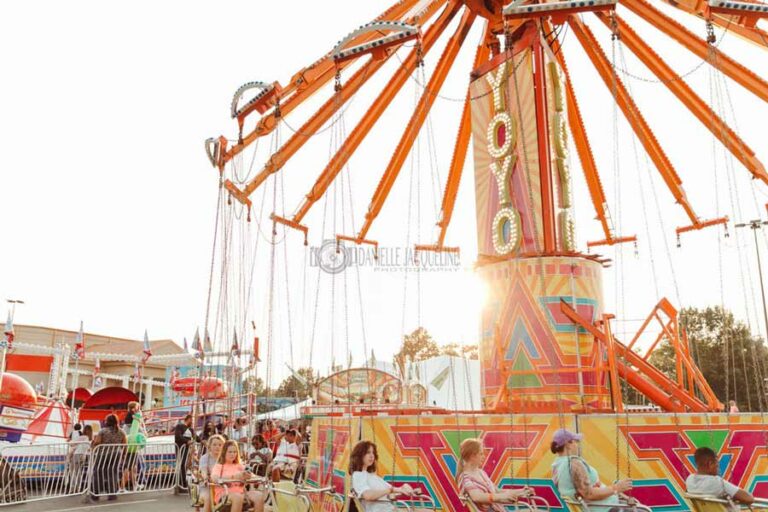 golden glow of dusk in memphis tennessee during midsouth fair grand opening 2022 kids swings ride by danielle jacqueline